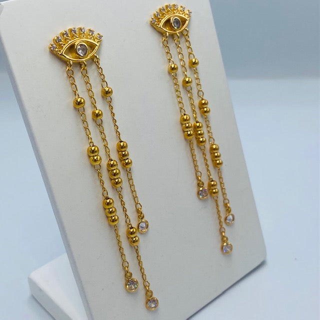 Aretes Ojo Griego con Cadenitas- Baño de Oro 18k